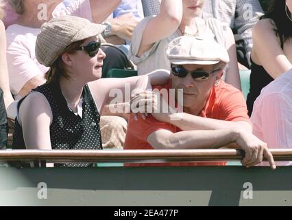 French actor Francis Perrin and his wife watch the match between French player Richard Gasquet and Spanish Rafael Nadal in the third round of the French Open at the Roland Garros stadium in Paris, France, on May 27, 2005. Photo by Gorassini-Zabulon/ABACA. Stock Photo