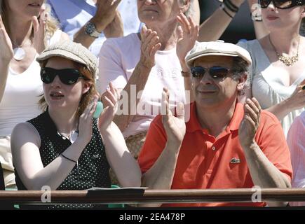 French actor Francis Perrin and his wife watch the match between French player Richard Gasquet and Spanish Rafael Nadal in the third round of the French Open at the Roland Garros stadium in Paris, France, on May 27, 2005. Photo by Gorassini-Zabulon/ABACA. Stock Photo