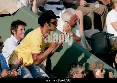Former French tennis player Yannick Noah, Amelie Mauresmo's coach, watches the match between French player Amelie Mauresmo and Ana Ivanovic in the third round of the French Open at the Roland Garros stadium in Paris, France, on May 28, 2005. Photo by Gorassini-Zabulon/ABACA Stock Photo