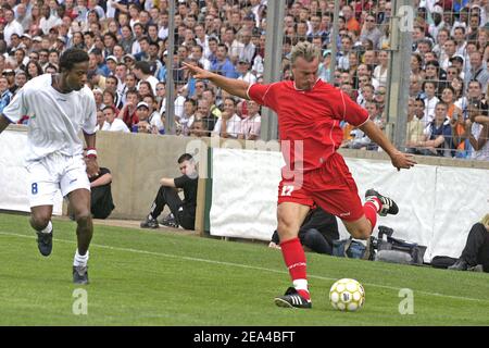 French soccer player David Ginola plays Liberia's Former FIFA World Player of the Year George Weah's farewell match at the Velodrome stadium in Marseille on June 11, 2005. Weah is moving from football to politics, planning to contest the presidential election due in Liberia by October. Photo by Gerald Holubowicz/ABACA. Stock Photo