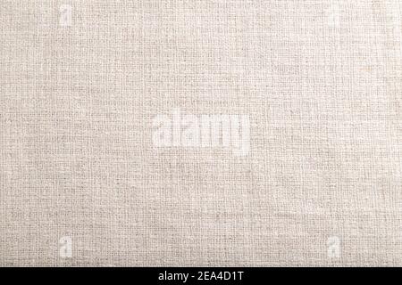 Fragment of smooth white linen tissue. Top view, flat lay, natural textile background and texture. Stock Photo