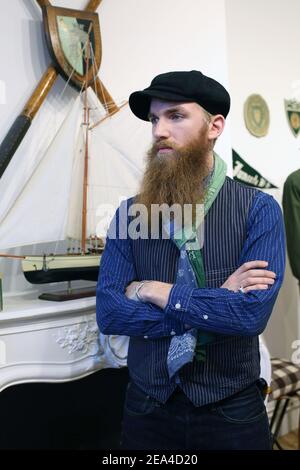 portrait of man with beard and baker boy hat  wearing stylish vintage clothing. Stock Photo