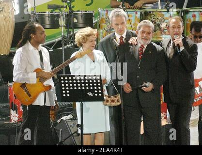 Culture Minister and music legend Gilberto Gil on stage, Brazilian President wife Marissa with Luiz Ignacio Lula da Silva and Paris Mayor Bertrand Delanoe, at the Place de la Bastille in Paris on July 13, 2005. Lula is in France on a four-day official visit and to attend the Bastille Day ceremonies during which Brazil is the guest country. Photo By Giancarlo Gorassini/Abacapress.COM Stock Photo