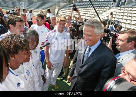 French Prime Minister Dominique de Villepin with Sports Minister Jean-Francois Lamour (R) visits the athletes of the French Athletics team at Charletty stadium in Paris, France, on August 2, 2005, to encourage them ahead of the 2005 IAAF World Championships to be held in Helsinki, Finnland, from 6 to 14 August. Photo by Laurent Zabulon/Cameleon/ABACAPRESS.COM. Stock Photo