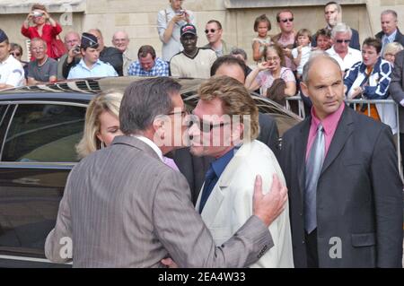 French producer Jean-Claude Camus and French singer Johnny Hallyday attend French actress Mimie Mathy and Benoist Gerard's wedding at the city hall of Neuilly-sur-Seine near Paris on August 27, 2005. Photo by Mehdi Taamallah/ABACAPRESS.COM Stock Photo