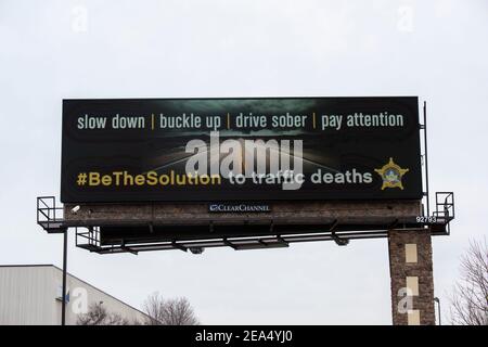 Fridley, Minnesota.  Message on billboard to slow down, buckle up, drive sober and pay attention to be the solution to traffic deaths. Stock Photo