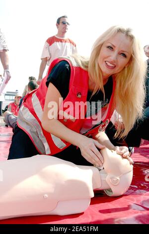 Red Cross ambassador, Czech-born model Adriana Karembeu, participates in a French Red Cross action to show first aid gestures at the Pharo Gardens in Marseille, southern France, on September 10, 2005. Photo by Gerald Holubowicz/ABACAPRESS.COM Stock Photo