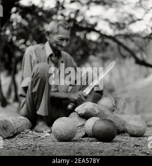 Craftsman is carving traditional bolas criollas in Lara state, Venezuela , South America Stock Photo