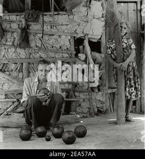 Mature man holding traditional bolas criollas in Lara state, Venezuela , South America Stock Photo