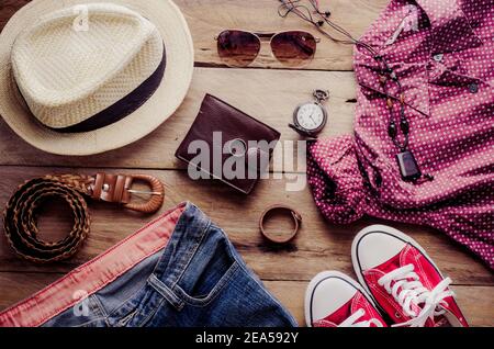 Clothing and accessories for womens on wood floor Stock Photo