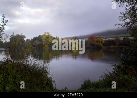 Walking around a lake in Seine Maritime, Normandy, France on a foggy autumn morning Stock Photo