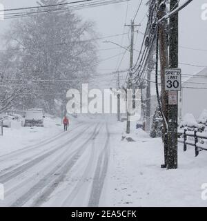 Norwalk, United States. 07th Feb, 2021. Person is walking in snow storm day on North Taylor Avein Norwalk (Photo by Miro Vrlik/Pacific Press) Credit: Pacific Press Media Production Corp./Alamy Live News Stock Photo