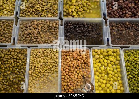 Different types of olives at street market Stock Photo