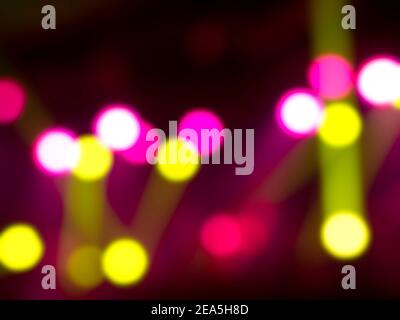 Blurred stage light concert background with colorful beam and laser rays on stage. Defocused entertainment show lighting bokeh. Stock Photo
