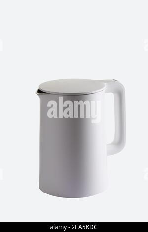 white plastic electric kettle isolated on white background. side view Stock Photo