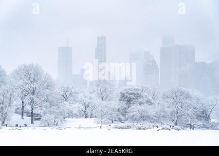 View south across the lake in Central Park with Manhattan's skyline in the background. Stock Photo