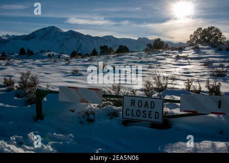 Hot Creek Geological Site is a famous landmark in Mono County. The hot springs, steam vents, curvy stream and mountain peaks create a beautiful scene. Stock Photo