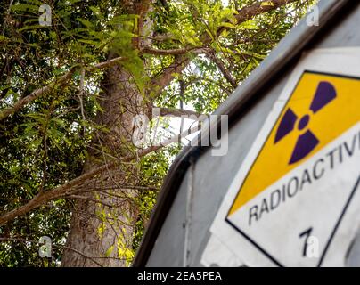 Radiation transport label Class 7 sticker affixed to the old sticker at the aluminum container of the transport truck Stock Photo