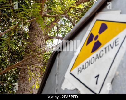 Radiation transport label Class 7 sticker affixed to the old sticker at the aluminum container of the transport truck Stock Photo