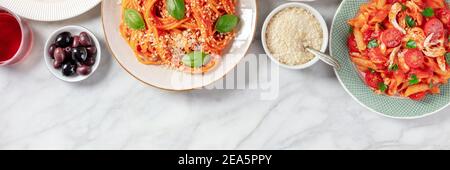 Italian pasta panorama, shot from above with copy space on a white marble background Stock Photo