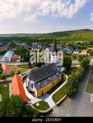 Aerial photo about the Church of the Assumption in Gyongyospata Hungary. Historical religious monument. Built in 12th century romanian baroque and got Stock Photo