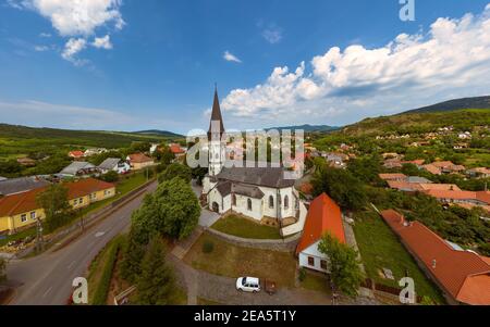 Aerial photo about the Church of the Assumption in Gyongyospata Hungary. Historical religious monument. Built in 12th century romanian baroque and got Stock Photo