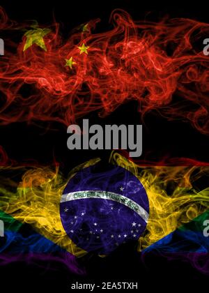 China, Chinese vs Brazil, Brazilian, Gay smoky mystic flags placed side by side. Thick colored silky abstract smoke flags. Stock Photo