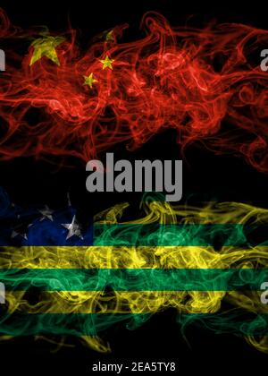 China, Chinese vs Brazil, Brazilian, Goias smoky mystic flags placed side by side. Thick colored silky abstract smoke flags. Stock Photo