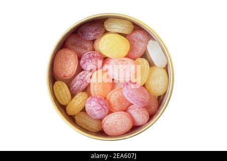 Colorful lollipops in a tin isolated on white background. Fruit drops. Copy space. Stock Photo