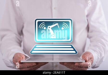 Industry 4.0 concept above a tablet held by a man in background Stock Photo