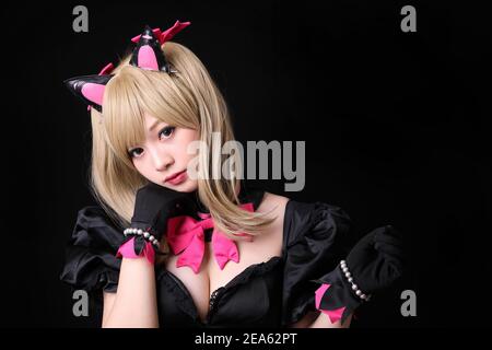 Portrait of Japan anime cosplay girl isolated in black background Stock Photo