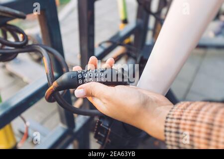 a combination lock on a scooter or bicycle as a symbol of property protection and theft. Stock Photo