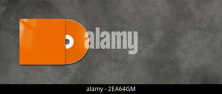 Orange CD - DVD label and cover mockup template isolated on horizontal concrete banner Stock Photo
