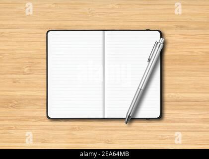 Black open lined notebook mockup with a pen isolated on wooden background Stock Photo