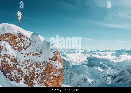 The summit cross on the Zugspitze east summit, Bavaria Germany. Stock Photo