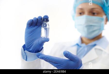 Doctor holding a vaccine. Fighting Infectious Diseases. Immunization concept. Stock Photo