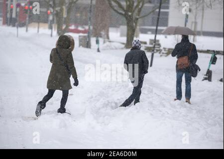 08 February 2021, Lower Saxony, Osnabrück: Pedestrians walk through the snow downtown. Photo: Jonas Walzberg/dpa Stock Photo