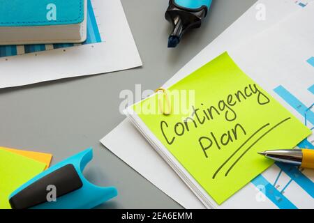 Business Contingency plan papers and notepad on the table. Stock Photo