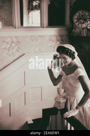 Vintage photo of Kennedy wedding. Jackie throwing the bouquet. September 12, 1953, Newport, Rhode Island Stock Photo