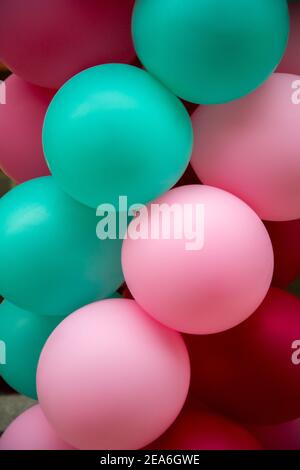 Balloons background. Pink, green, red color balloon decoration Stock Photo