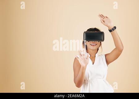 Young woman playing video game Stock Photo