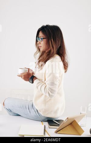 Woman having coffee break Stock Photo