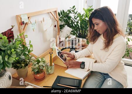 Woman working at home office Stock Photo