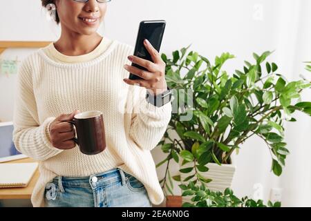 Businesswoman checking notifications Stock Photo
