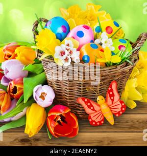 Colorful Happy Easter decoration with flowers and eggs Stock Photo