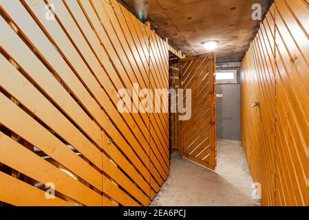 Interior of hallway with wooden walls and doors. Storage rooms in house. Stock Photo