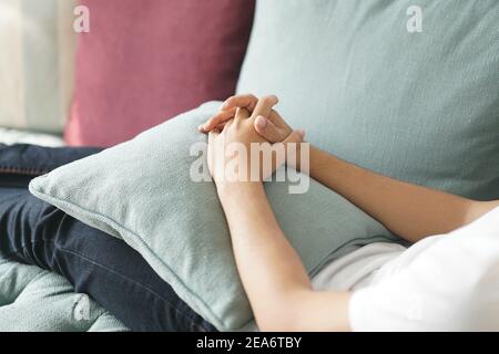 tired exhausted lazy asian young man teenager sleeping resting napping on sofa at home Stock Photo