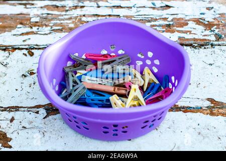 Round box purple on the blue surface, view from the top front. Stock Photo