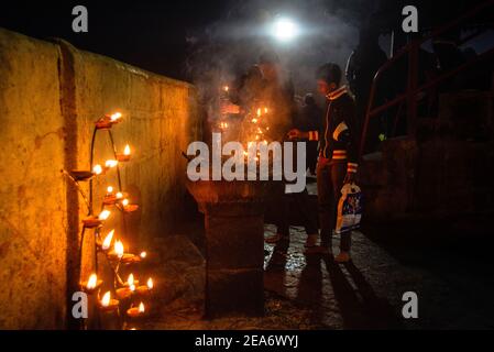 Cingalese people lighting candles Night time of Adam's peak Sri Lanka Stock Photo