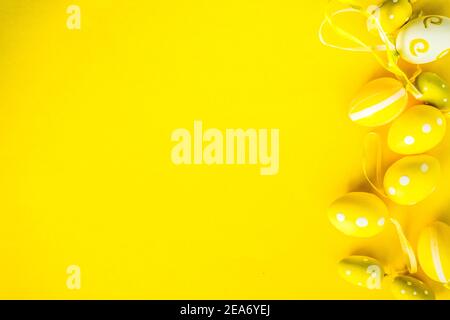Painted Easter eggs on a yellow background Stock Photo